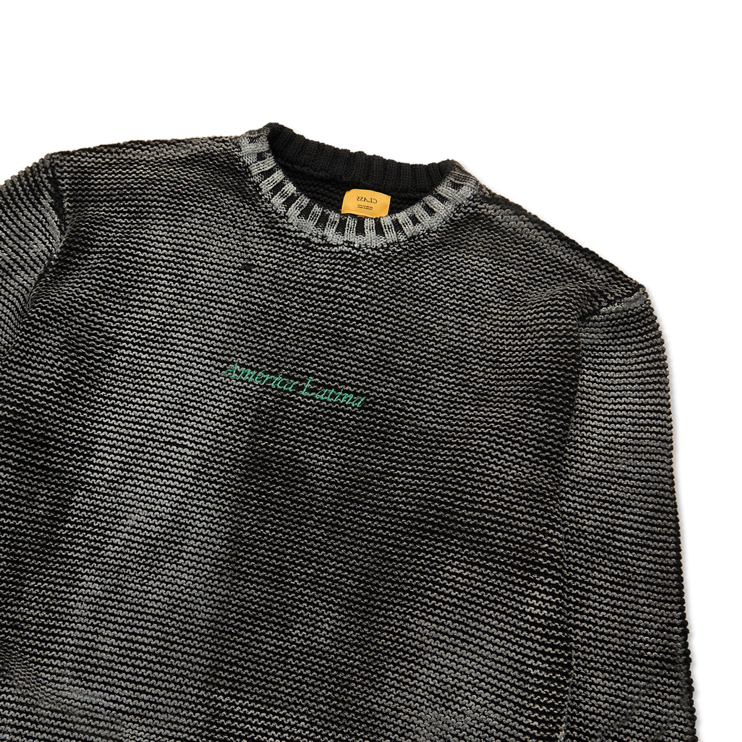 Suéter de tricô jacquard preto com gola canelada e faixa verde no peito