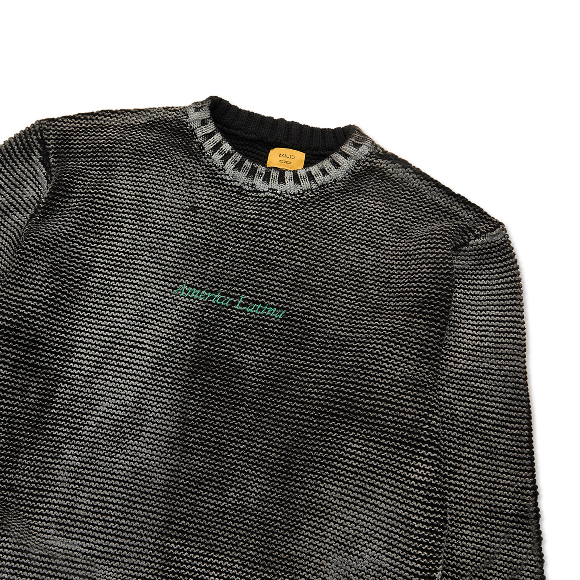 Suéter de tricô jacquard preto com gola canelada e faixa verde no peito
